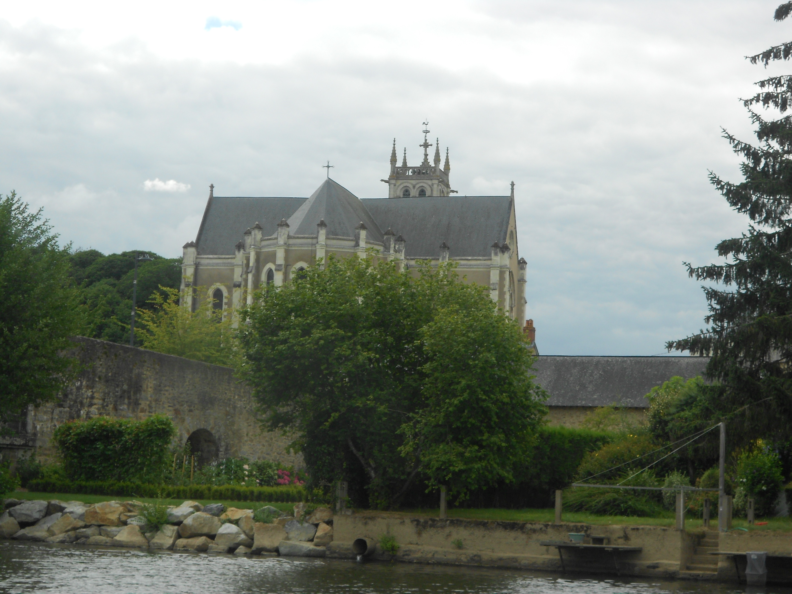 Church along the riverside in Laval, France