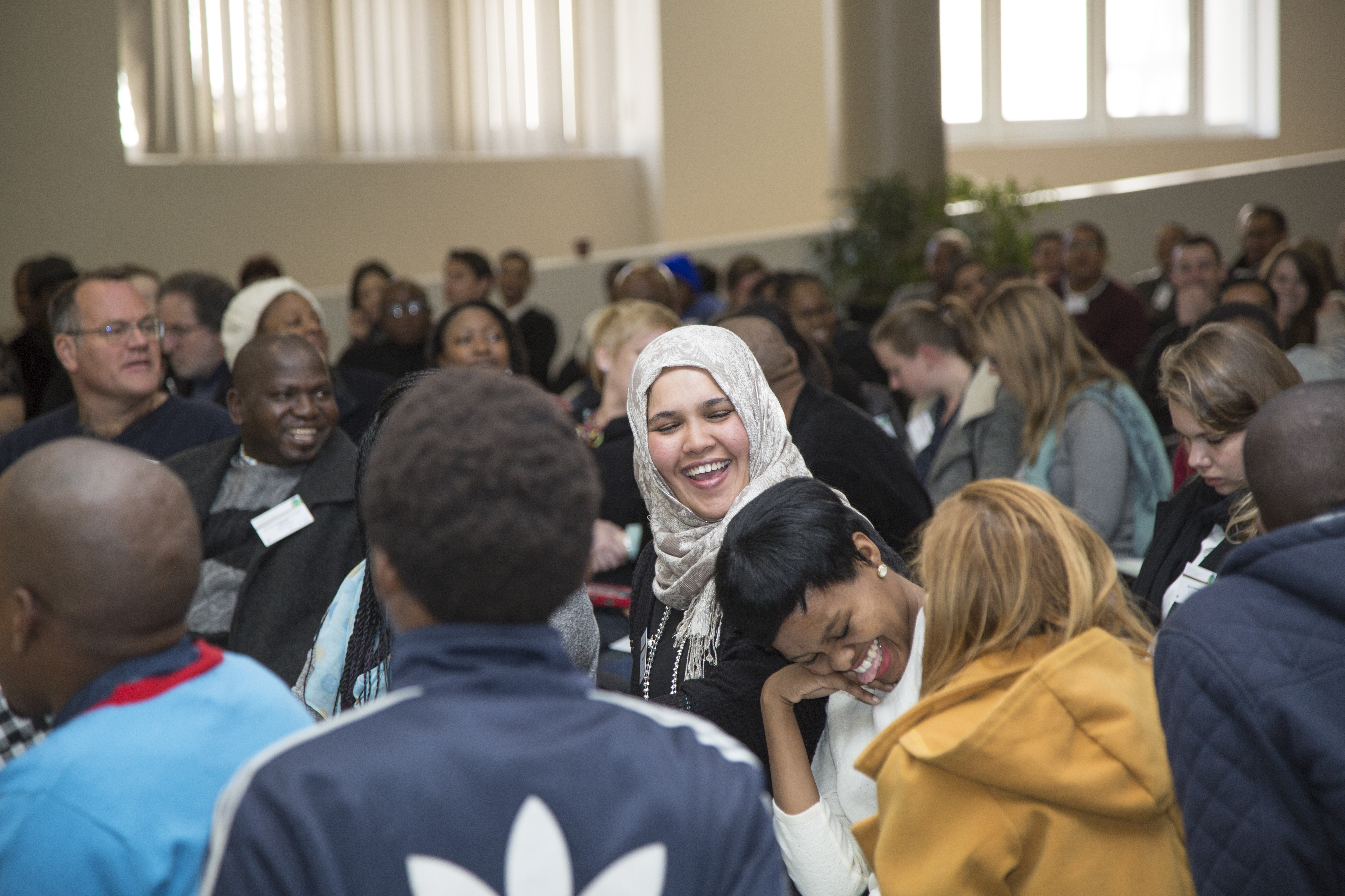 My friend Bilqees wearing a headscarf and me in a bright mustard coat