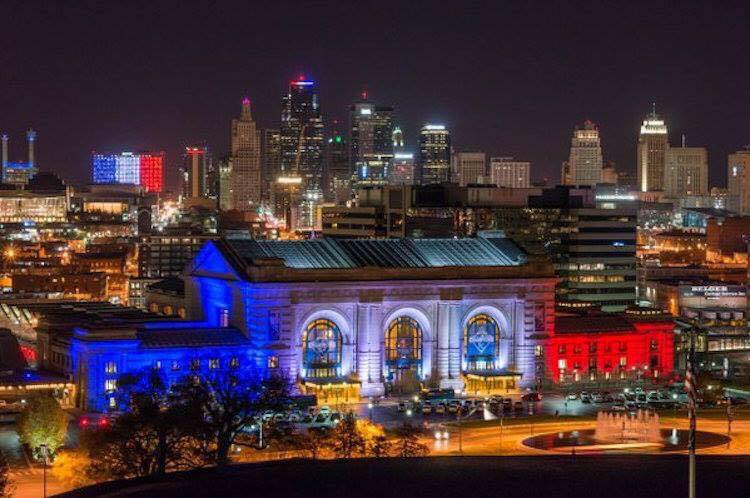 Honoring the 100th anniversary of the end of World War I, Union Station (foreground) and all of KC is lit up in the tri-colors of the French Flag.[