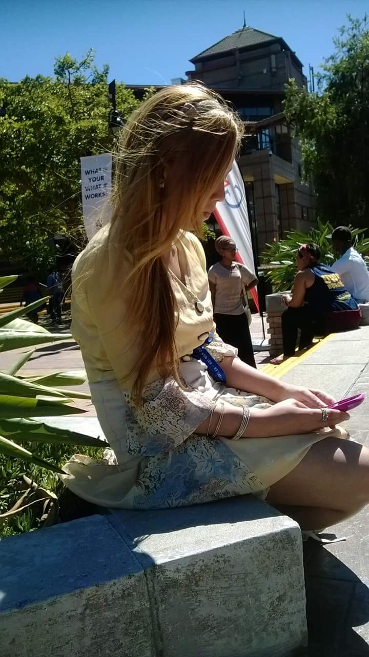 Vintage clothes are popular in Cape Town. I'm wearing my moms' outfit from the 70's here.